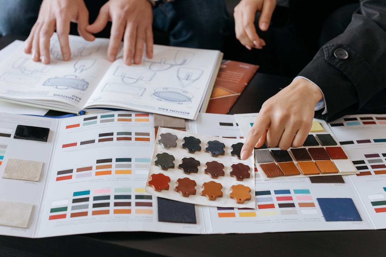 services-02 Designers reviewing color swatches and sketches for project planning.